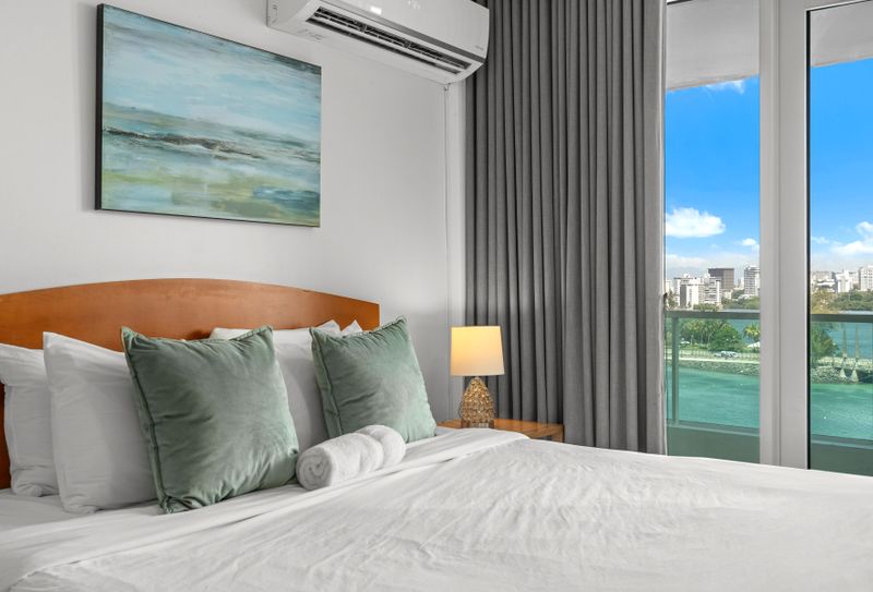Enjoy resort-style living with a spacious bedroom area and private balcony overlooking the beautiful lagoon.