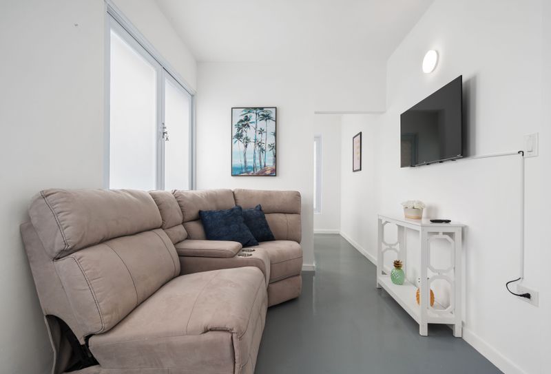 The natural light and indoor greenery create a peaceful haven for your city escape.