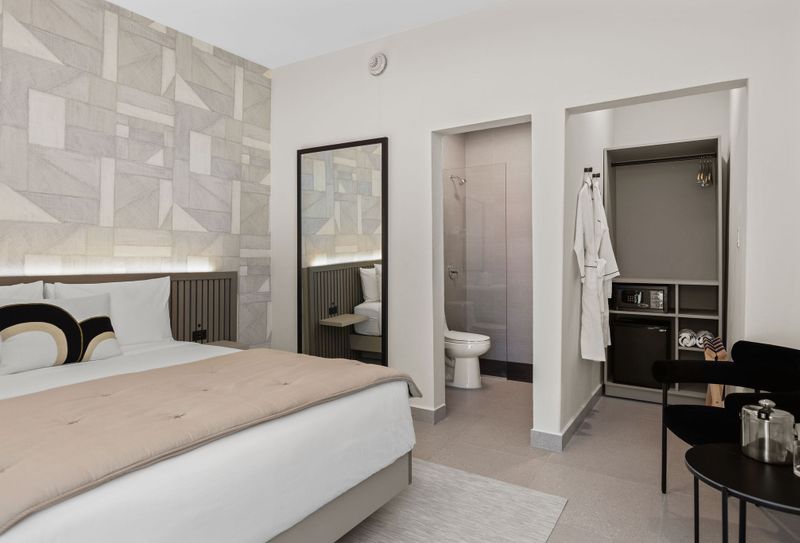 Comfortable bedroom with easy access to a modern bath.