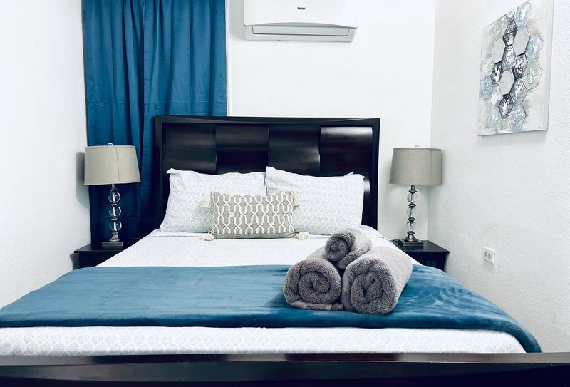 Eco Friendly | Solar Powered Stay 4 Indulge in ultimate comfort in our serene main bedroom, featuring a luxurious queen-size bed and a Smart TV for your entertainment. Perfect for unwinding after a day of adventures.