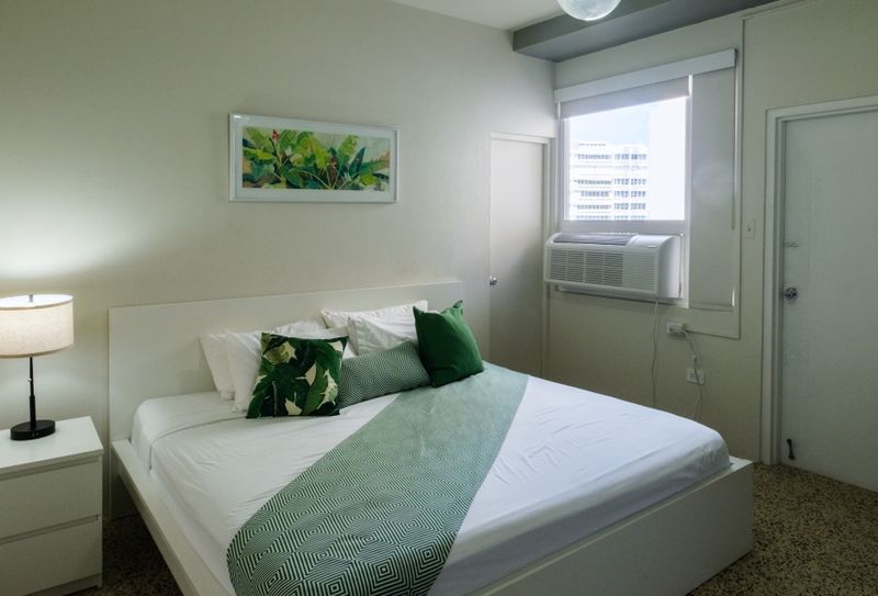 Step into a clean and naturally lit bedroom designed for ultimate relaxation. The fresh decor and comfortable setup promise a truly rejuvenating stay.