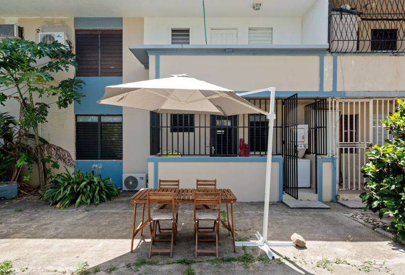 Al Fresco Dining Dreams: Enjoy delightful meals under the sun or stars on our charming outdoor patio, complete with comfortable seating and a large umbrella for shade.