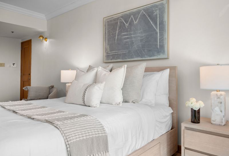 Comfortable studio bedroom with a ceiling fan, TV, and direct access to stunning views.