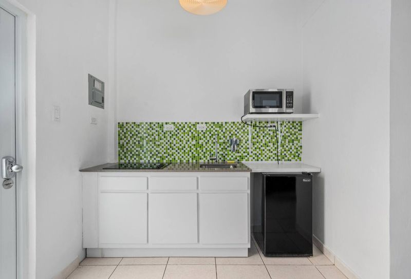 The kitchen is fully stocked with essential amenities for cooking and dining, such as a stove, oven, refrigerator, microwave, and other necessary appliances.