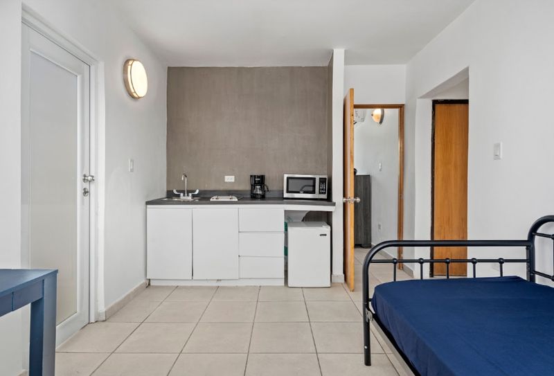 This inviting room offers a perfect mix of modern amenities and natural light, providing a peaceful retreat after a day of exploration.
