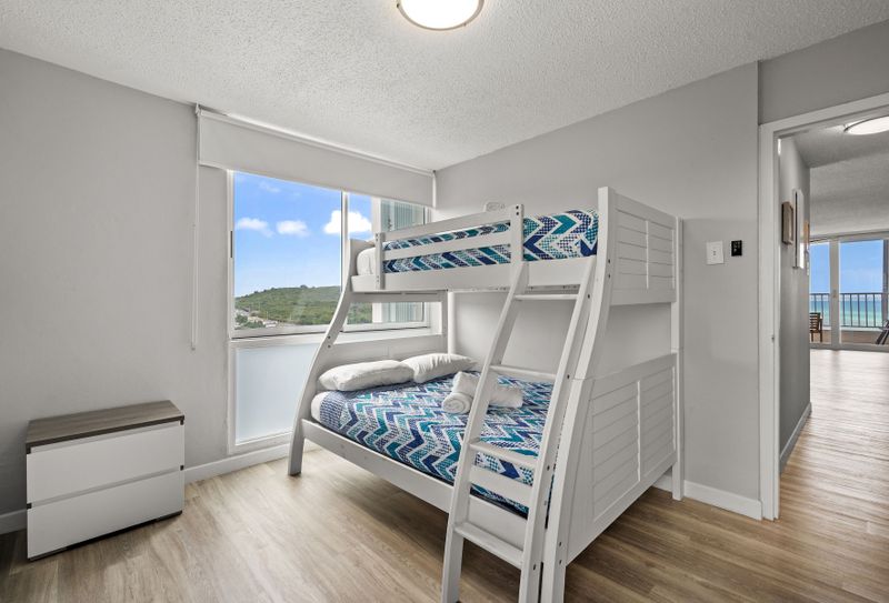 Adventure awaits for the younger guests (or young at heart)! This fun and functional room features sturdy bunk beds, providing a comfortable and exciting sleeping arrangement for kids or extra guests.