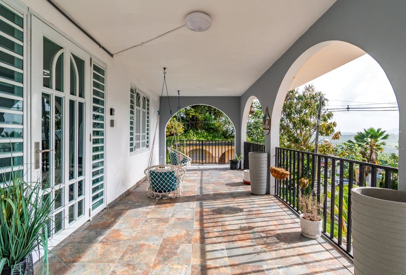 Enjoy the fresh air on your spacious patio with a swing chair.