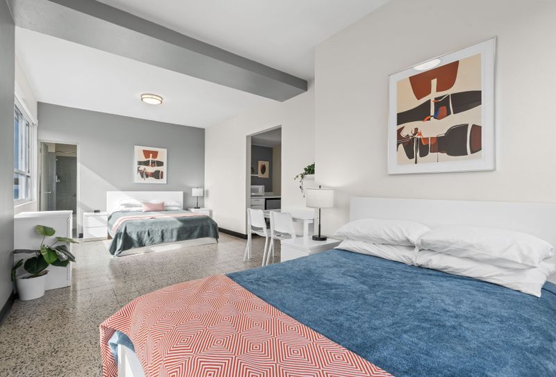 Immerse yourself in a relaxing atmosphere within this stylish bedroom, adorned with subtle artistic touches that create a unique and inviting space.
