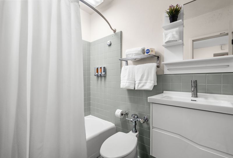 Olimpo | Room With Balcony 4 Style in Every Corner. A bathroom with personality and all the essentials.