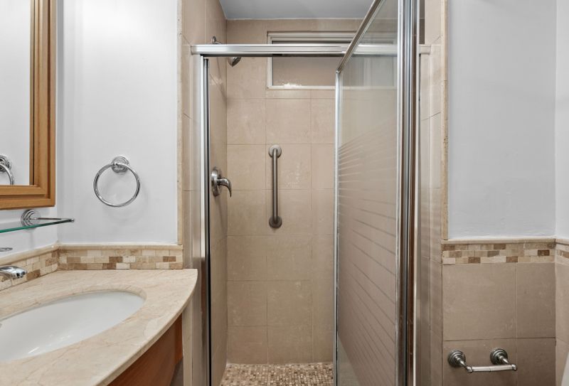 Clean and modern bathroom with a spacious walk-in shower for a refreshing start to your day.