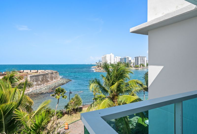 Embrace the beauty of the coastline from your balcony, where historic architecture meets the endless ocean. A captivating view.