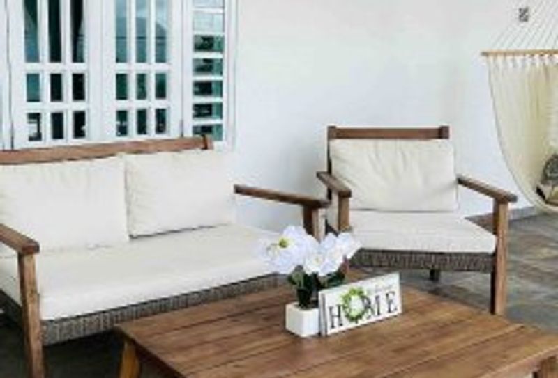Unwind in style! Our spacious outdoor terrace, complete with a comfy sofa, additional seating, a relaxing hammock, and a convenient table, is your private oasis for relaxation and al fresco dining.