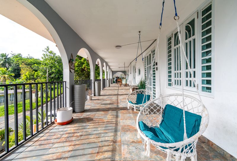 Enjoy the fresh air and lush surroundings from your private balcony.
