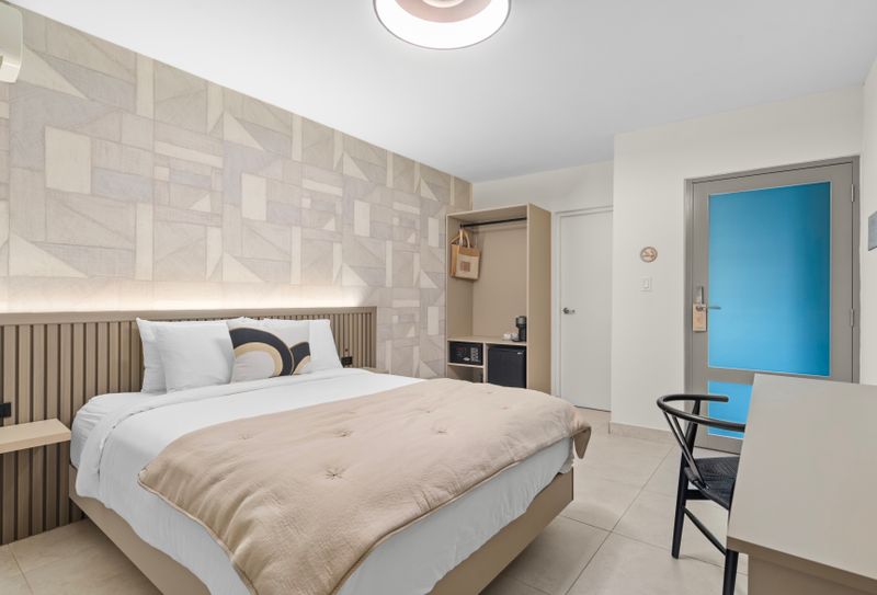 Sink into the plush bed, complete with crisp linens and soft pillows.