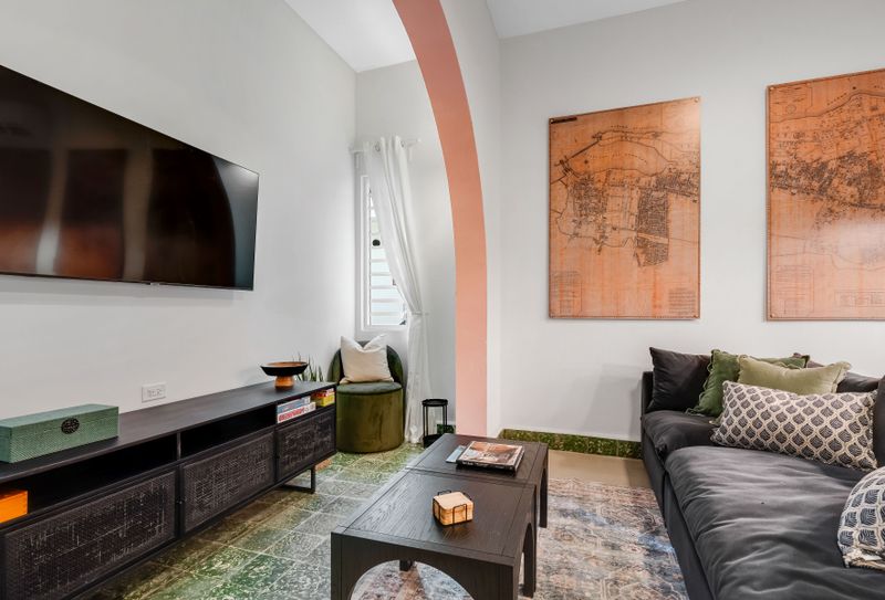 Cozy living area with a large-screen TV, perfect for movie nights and relaxing evenings