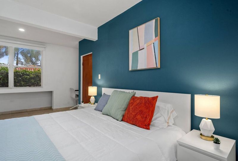 A peaceful retreat with soft bedding and a clean, elegant design.