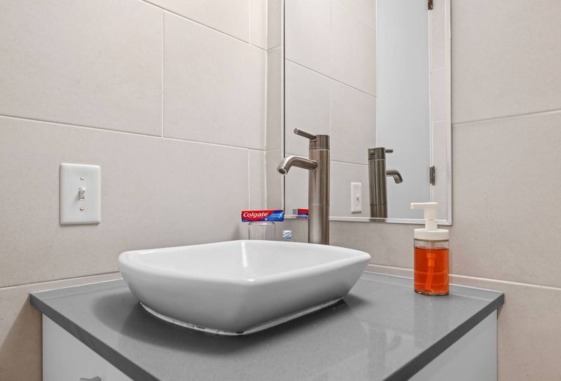 Stylish sink with a sleek, modern faucet.