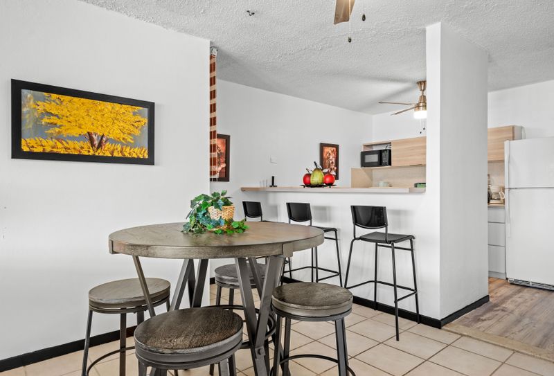 Our kitchen bar area is the ideal spot for casual dining or catching up over a cup of coffee.
