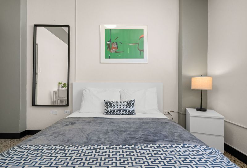 Modern, bright Queen room; the perfect stylish retreat for your stay.