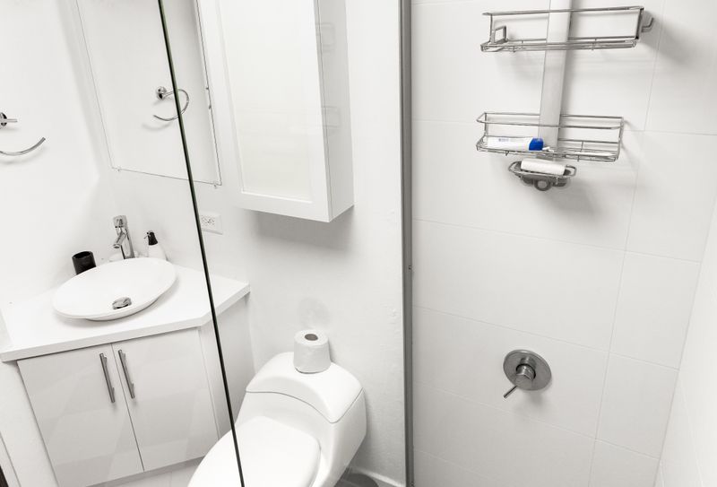 Refresh and rejuvenate in the sleek and modern bathroom. Enjoy a luxurious rain shower, convenient organizers for your toiletries, and a stylish stainless steel faucet, all designed for your comfort and convenience