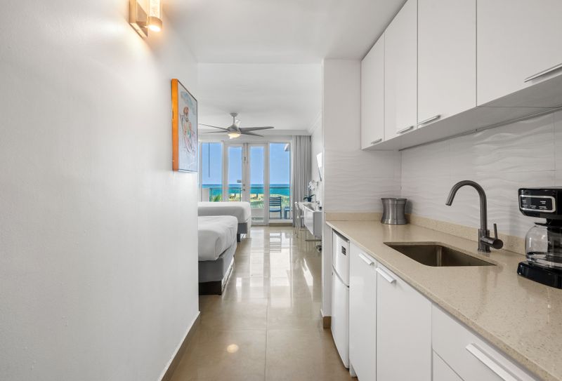 Stunning ocean view studio with direct balcony access and a convenient kitchenette. Experience comfort and breathtaking scenery.