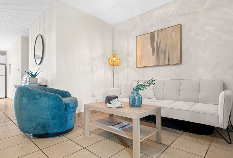 Relax and unwind on the comfortable sofa in this inviting living room.
