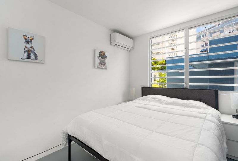 Bask in the comfort of a queen-sized bed in a bright room.