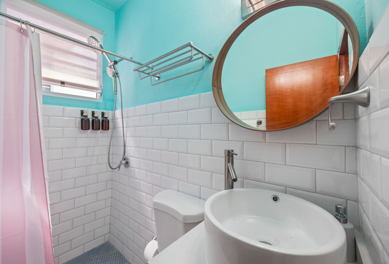 Fresh and clean: a bright bathroom with a crisp white and aqua color scheme.