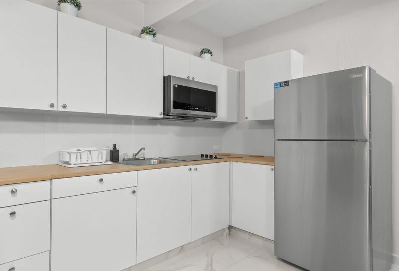 Fully stocked kitchen with new appliances. Cook like home!