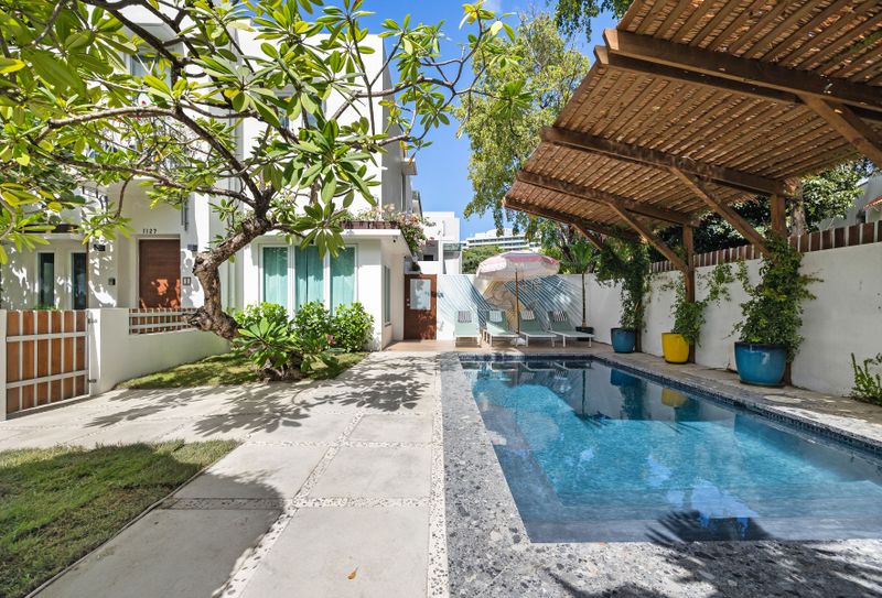 Private pool paradise with a stylish pergola, perfect for sunny days and cool dips.