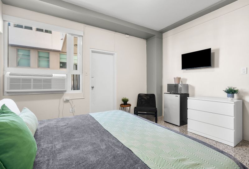 Sleep soundly in this serene bedroom with a comfortable king-size bed.