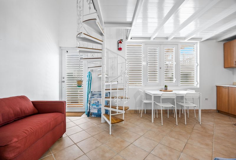Enjoy meals in a bright dining area with open layout to a fully-equipped kitchen – perfect for group stays.