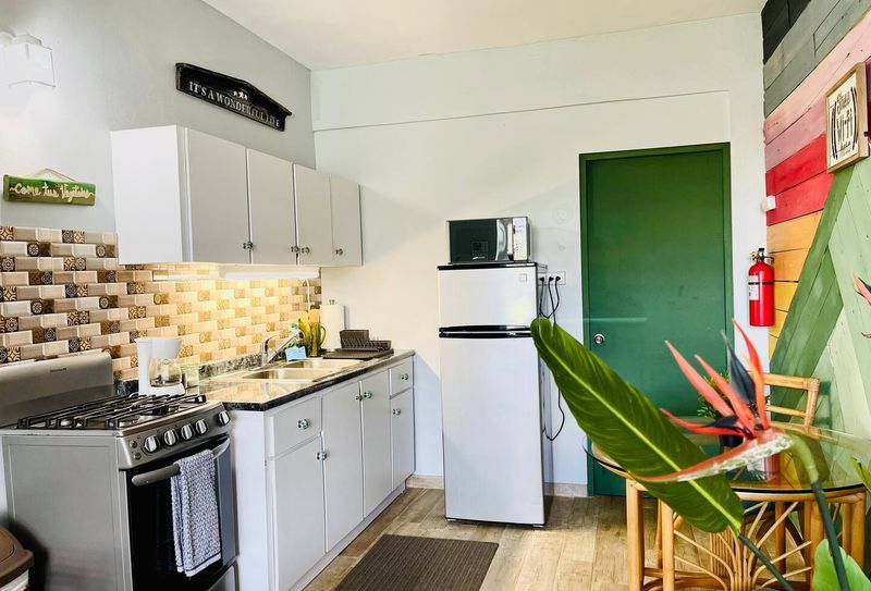 FULL KITCHEN WITH REFRIGERATOR, STOVE, MICROWAVE , BLENDER , COFFE MAKER, UTENSILS , CABINETS, COFFEE TABLE