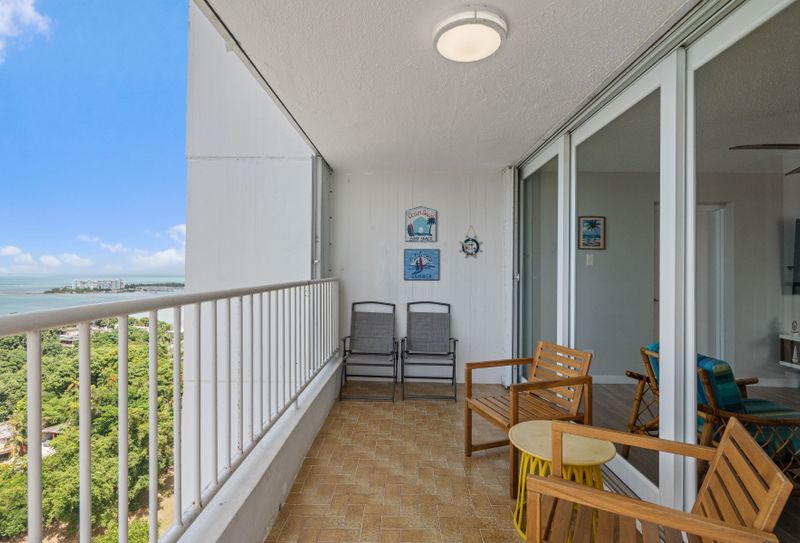 "Your private outdoor oasis! This inviting balcony features comfortable seating, offering a perfect spot to enjoy your morning coffee, read a book,