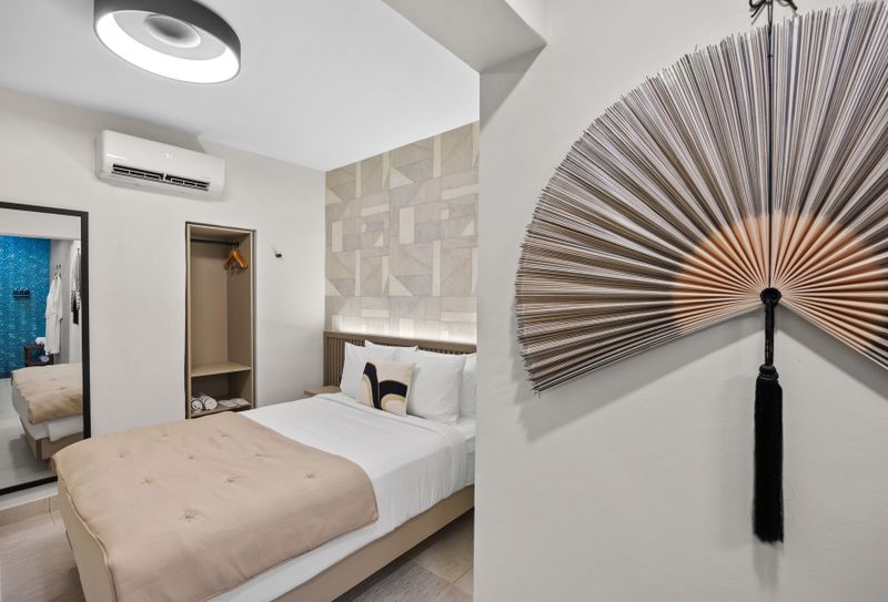 Sun-drenched sanctuary with a plush bed draped in crisp linens