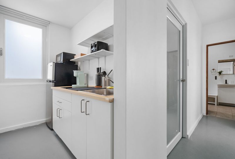 Bright and airy kitchen with ample counter space for meal prep.