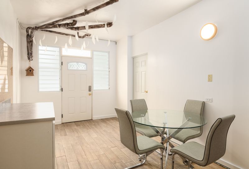 Bright & airy interior with dining area.