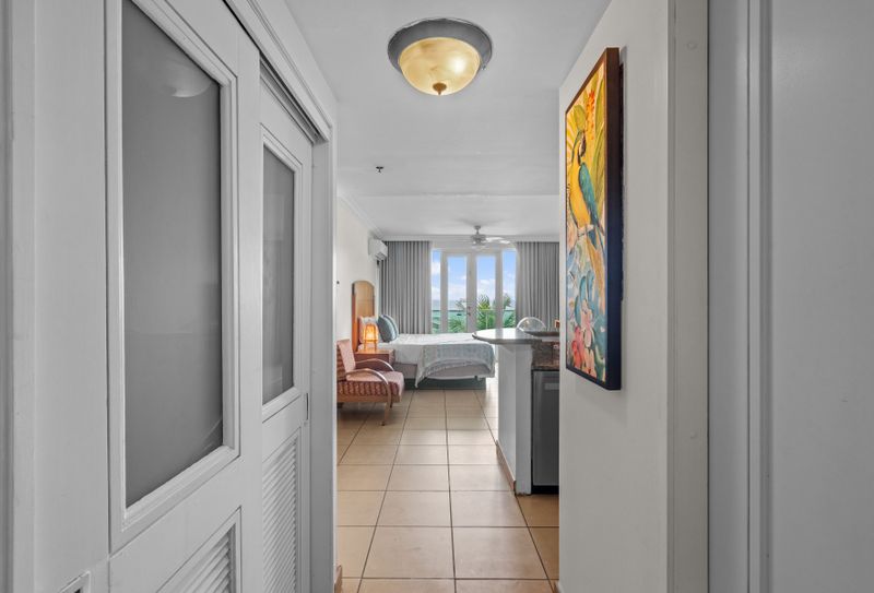 Sleep with a view. Enjoy unparalleled lagoon and ocean panoramas right from your bed, complemented by modern comforts like AC and a ceiling fan for a perfect night's rest.
