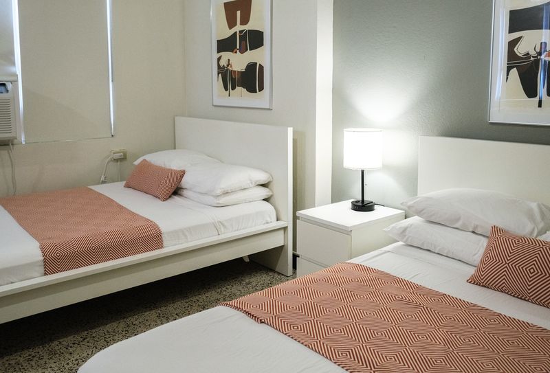Settle into a peaceful night's sleep in this tranquil bedroom. The soft lighting and comfortable bedding are perfect for unwinding and recharging.