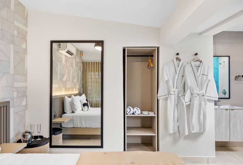 Sophisticated hotel-style room complete with fluffy bathrobes waiting to envelop you in luxury after a refreshing shower or bath.