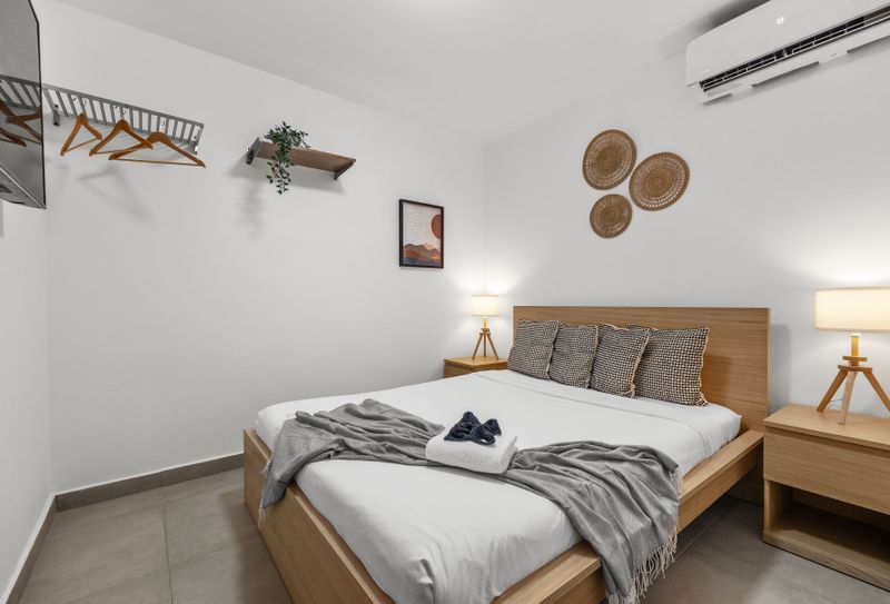 Stay cool and entertained in this comfortable bedroom, complete with air conditioning and a flat-screen TV for your convenience.