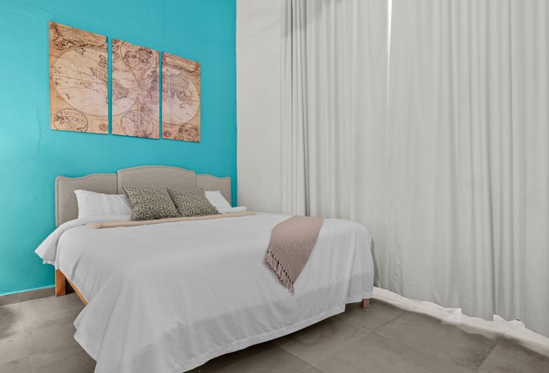 The comfortable bed and ample storage make this space both stylish and practical, offering a perfect retreat for relaxation.