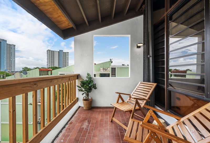 Relish the peaceful environment from this inviting balcony, offering a glimpse of the marina through a picturesque window-like opening.
