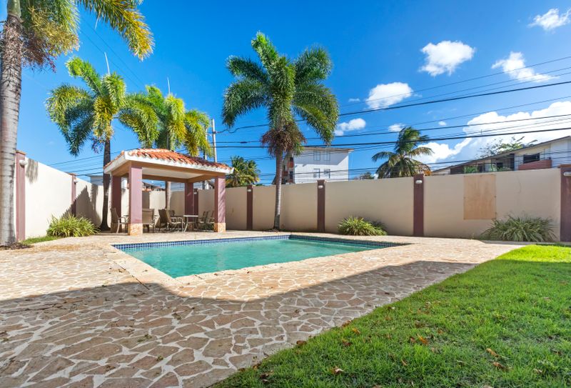 Escape to a private garden paradise with a shimmering pool