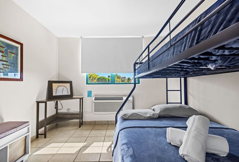 Spacious double bedroom with natural light and outdoor views.