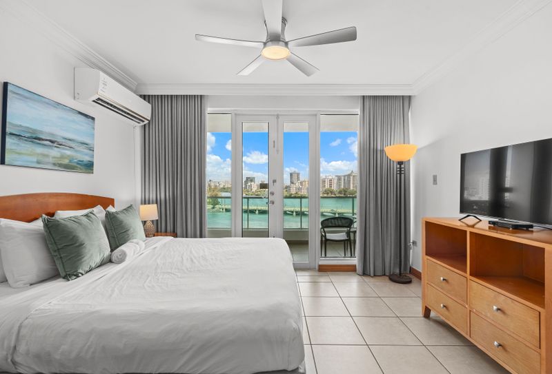 Wake up to breathtaking lagoon views from your comfortable bed, a truly serene experience.