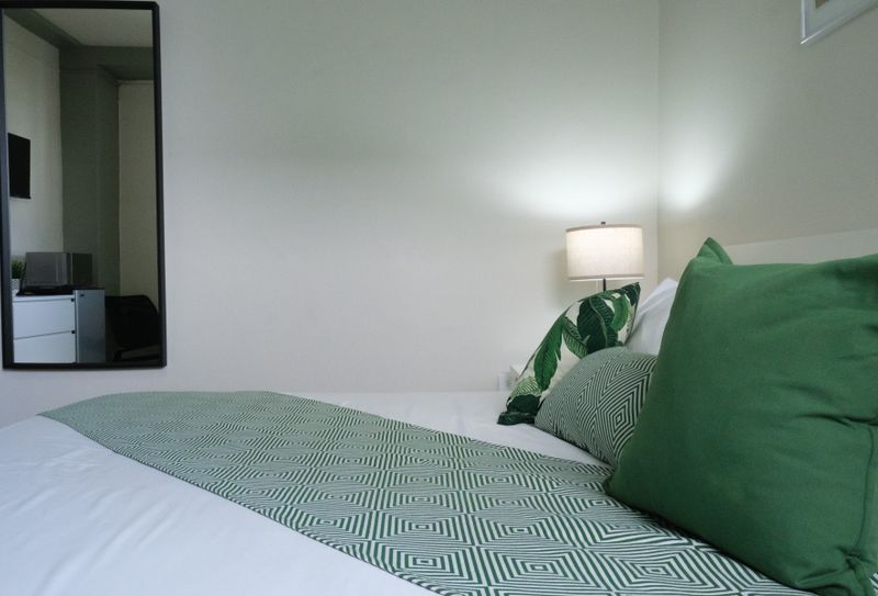 Unwind in a serene setting! This comfortable bedroom is thoughtfully decorated to provide a calming ambiance, ensuring a peaceful and enjoyable stay.