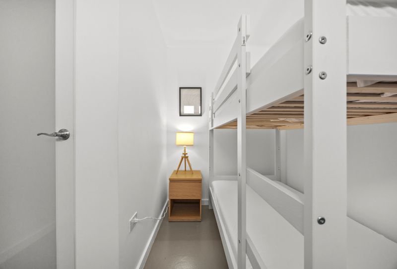 Sleep tight, times two! Bunk bed magic for this shared bedroom.