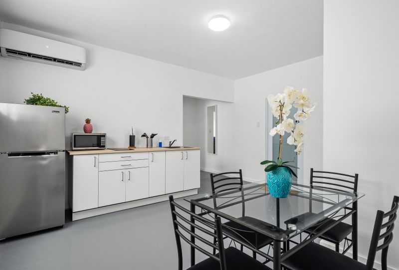 This kitchen and dining area is a cozy and chic space to enjoy your stay.