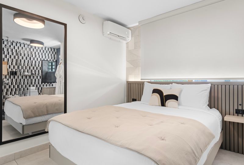 Indulge in ultimate comfort in this luxurious bedroom, showcasing a plush bed and elegant decor